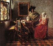 VERMEER VAN DELFT, Jan A Lady Drinking and a Gentleman wr oil